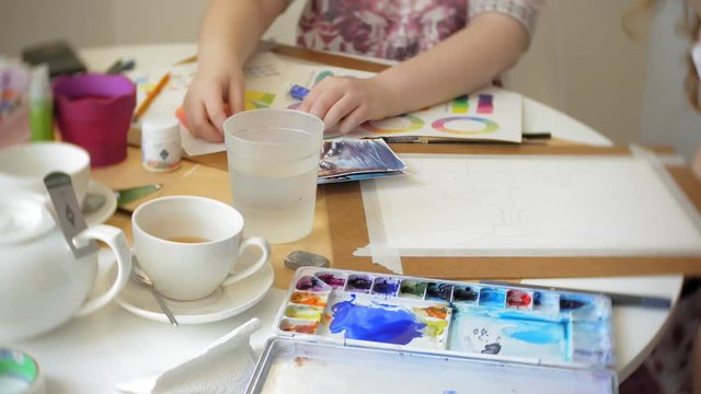 Two Young woman artist painting at home studio creative tools