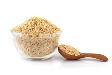 brown rice in glass bowl on white background , healthy food