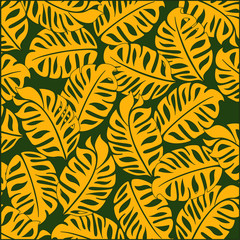 Bright tropical design. On a green background bright yellow  tropical leaves.