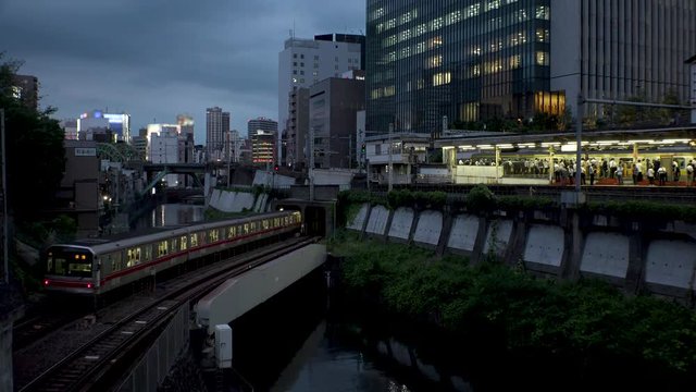 OCHANOMIZU, TOKYO,  JAPAN - CIRCA JUNE 2018 : Scenery of OCHANOMIZU train station and KANDA RIVER.  Marunouchi line,  Sobu line,  Chuo line, three train lines crossing over.