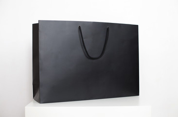 Black blank shopping bag on a white background. Mock up.
