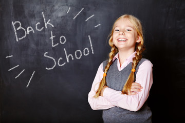 schoolchild on blackboard background