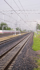 railroad in spring rainy day, view from station. background, transportation