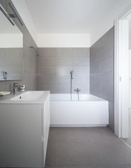 Naklejka na ściany i meble Modern bathroom with large tiles in newly built apartment