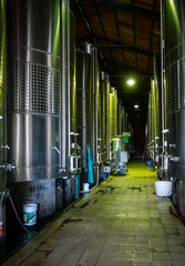metal wine barrels in a winery