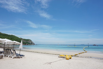 Fototapeta na wymiar Beach chair, Floating buoys and beautiful blue sea and sky; Samae-San Island Thailand 
