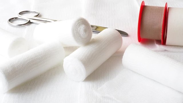 Medical bandages with scissors and sticking plaster. Medical equipment.
