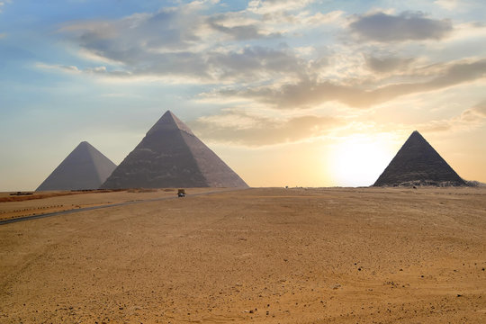 Great pyramids in Giza valley during sunset. World famous landmark in Egypt.