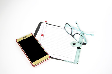 Notebook with glasses with smartphone