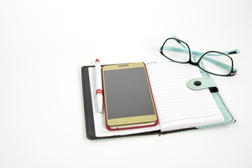 Notebook with glasses with smartphone