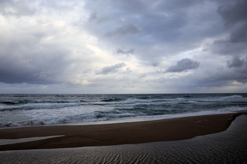 Dark storm clouds looming of a beach on the Sea of Japan