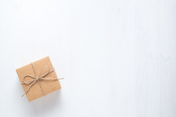 gift box tied with string on a white background