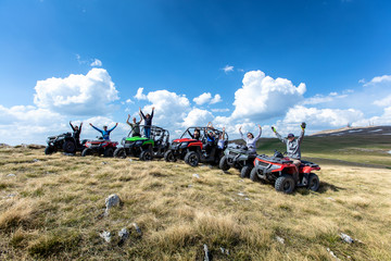 Friends driving off-road with quad bike or ATV and UTV vehicles © FS-Stock