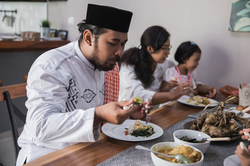 muslim family together break fasting