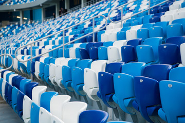 Obraz premium Sport stadium Plastic chairs in a row.