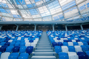 Cement stairs and blue seats inside football stadium