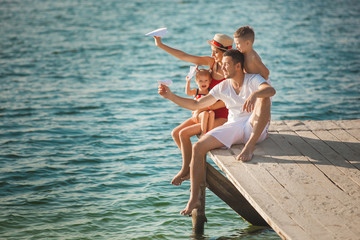 Fototapeta na wymiar Cheerful family on the beach. Family on vacation