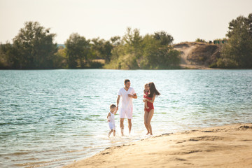 Cheerful family on the beach. Family on vacation