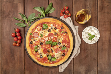 Pepperoni pizza with white wine, ingredients, and place for text