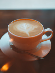 a cup of coffee cappuccino latte on wooden background