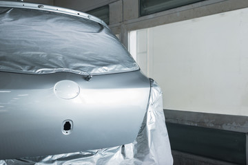 Fototapeta na wymiar Auto body repair series: Freshly paint car in paint booth