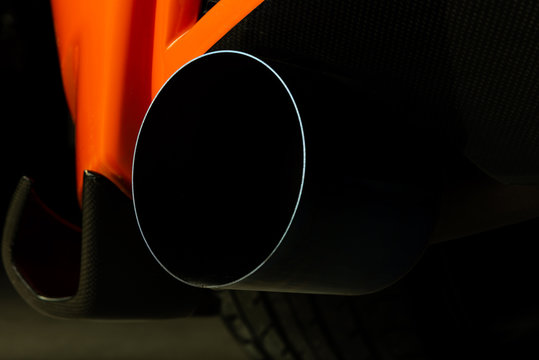 Fototapeta Car detailing series: Closeup of sports car exhaust pipe
