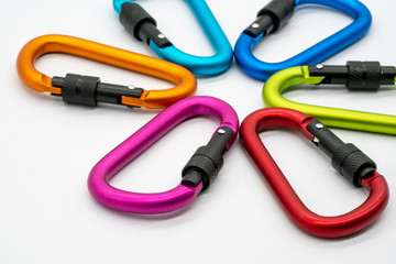 Colorful matte metal aluminum snap hook isolated on white background.