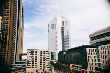 Jumeirah Emirates Towers in Dubai city center, skyscraper with palm.