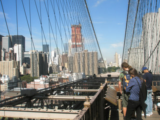 Brooklyn bridge and view of Manhattan and the city of New York on a sunny day