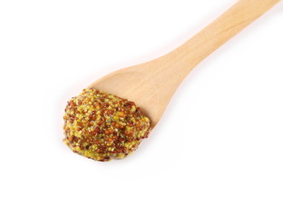French mustard spreading with wooden spoon, isolated on white background and texture, top view