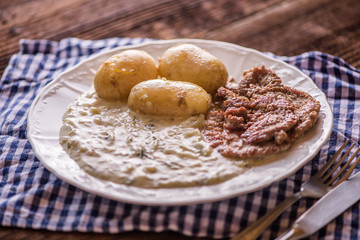 green pumpkin sauce with dill, new potatoes and pork medalions