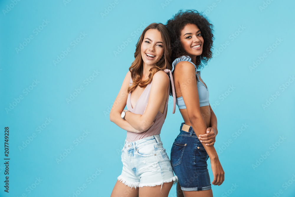 Poster Two happy young girls dressed in summer clothes