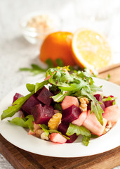 Salad with apple, beet, arugula and walnuts