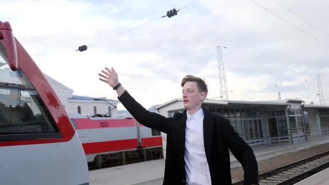 Young businessman rushing and missing train, late to work. Train station running unpunctual man, shaky camera