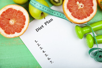 Food and sheet of paper with a diet plan