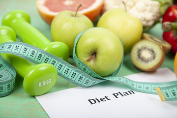 Food and sheet of paper with a diet plan