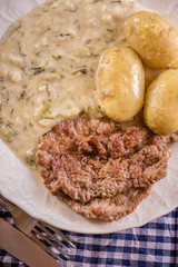 green pumpkin sauce with dill, new potatoes and pork medalions