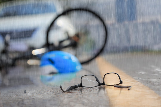 Fototapeta Accident car crash with bicycle on road in rainy weather