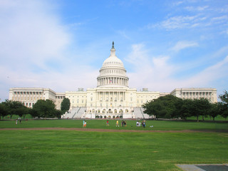 Capitol in Washington DC and a green lawn on a sunny day