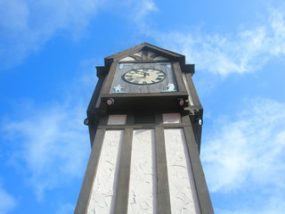 black and white clock tower on a sunny day