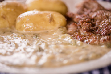 green pumpkin sauce with dill, new potatoes and pork medalions