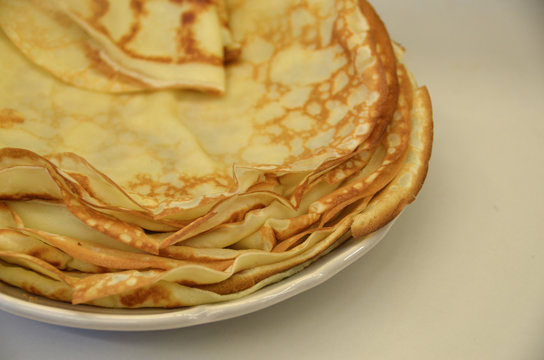 Blini. Tasty Russian pancakes on white table. Close up