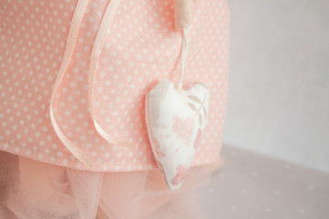 Fototapeta na wymiar soft pink toy Doll Angel in the style of Tilda