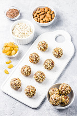 Raw vegan healthy dessert, date and nuts bliss balls, ingredients. Top view, space for text.