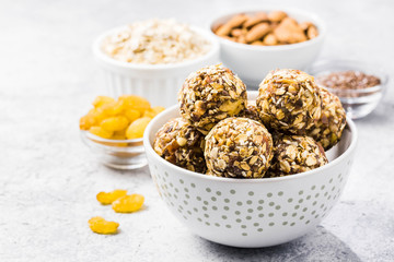 Raw dried fruit, oatmeal, nuts energy balls. Selective focus, space for text.