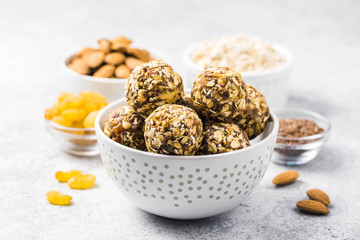 Raw dried fruit, oatmeal, nuts energy balls. Selective focus, space for text.
