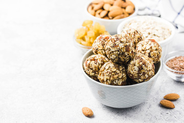 Vegan dessert, raw oatmeal nuts fruit bites. Selective focus, space for text.