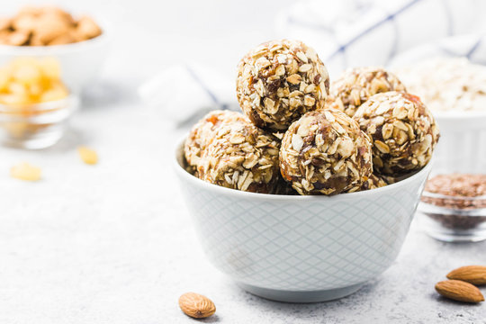 Vegan dessert, raw oatmeal nuts fruit bites. Selective focus, space for text.