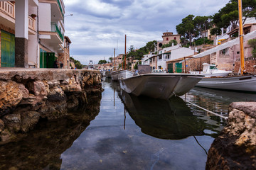 Fototapeta na wymiar Picturesque small harbor in the south of Mallorca, Balearic islands, Spain. Mediterranean seascape.