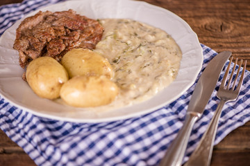 dill and pumkin sauce with new potatoes and meat